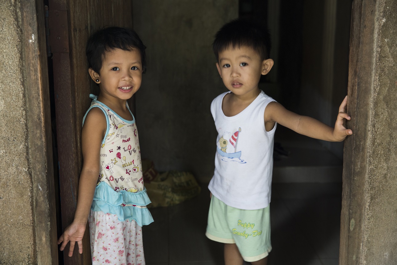 Children play in their home in Barangay Puypuy, Laguna, Philippines