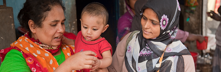 A community health worker visits homes as part of her rounds in the Mirpur locality in Dhaka.