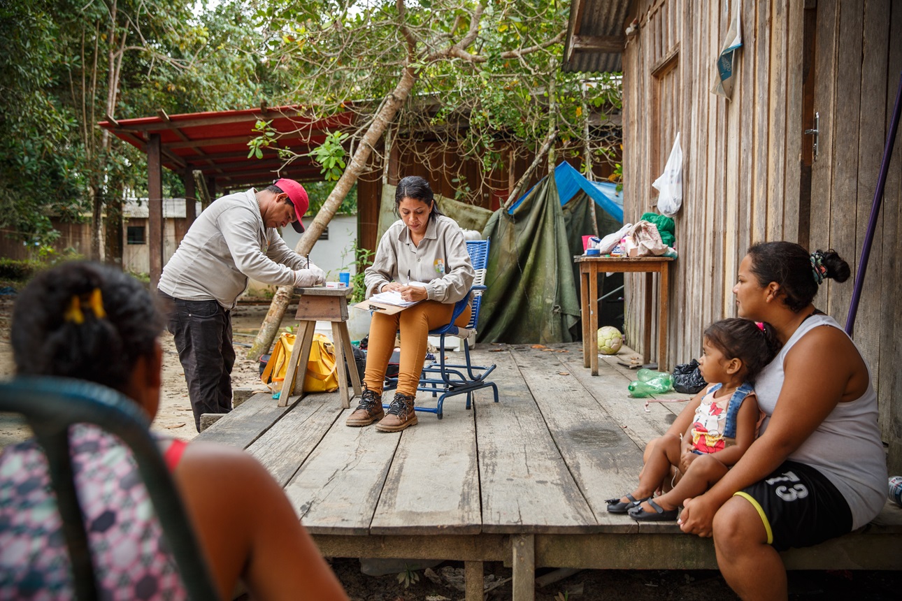 A community health worker provides services to residents in Brazil.