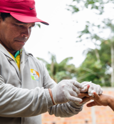 A community health worker administers a test for malaria in a rural area of Manaus, Brazil