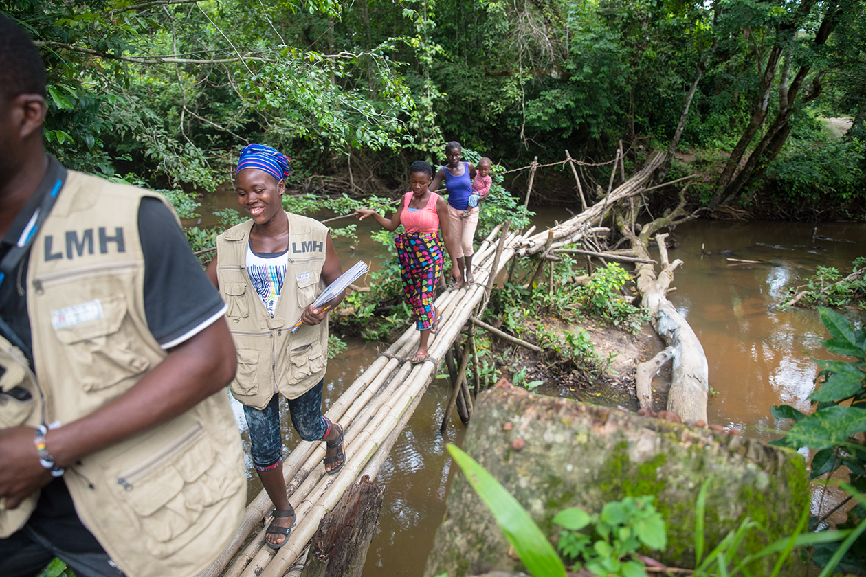 Community health workers making their rounds, vising rural homes in Rivercess County, Liberia.
