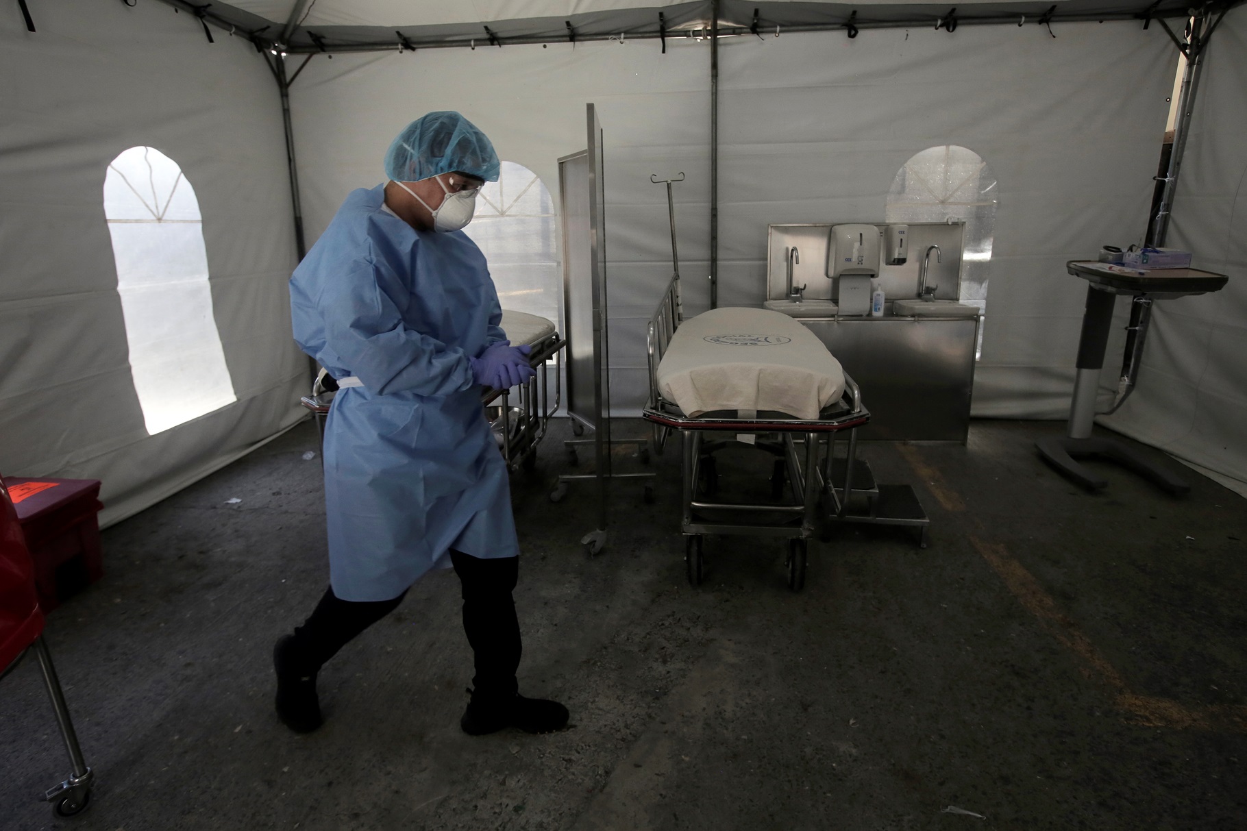 A member of the medical personnel wearing a protective face mask is seen at a tent triage prepared for suspected COVID-19 patients in San José, Costa Rica, March 13, 2020.