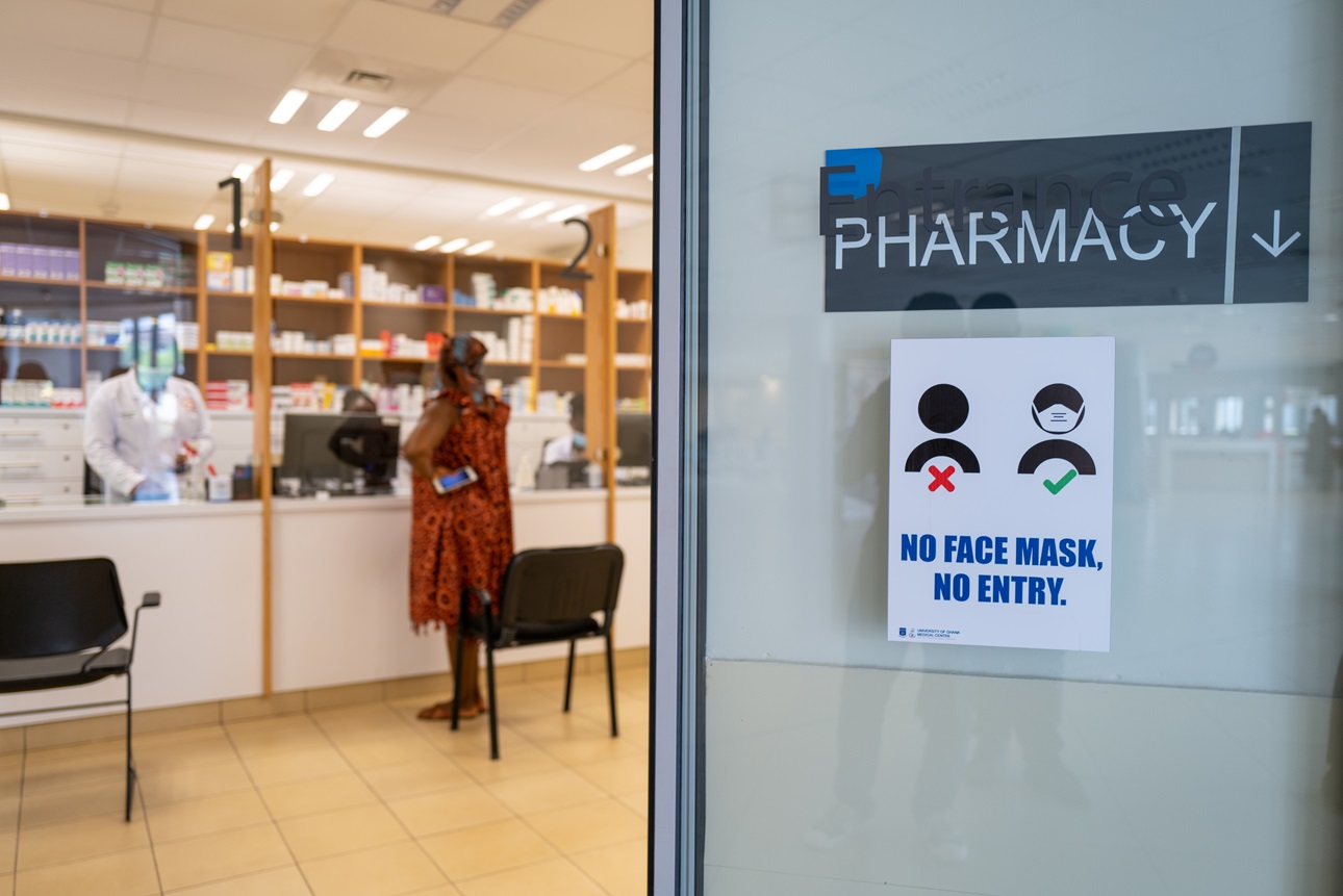 COVID-19 signs and warnings at a pharmacy in the University of Ghana Medical Center in Accra, Ghana, on June 24, 2022. 