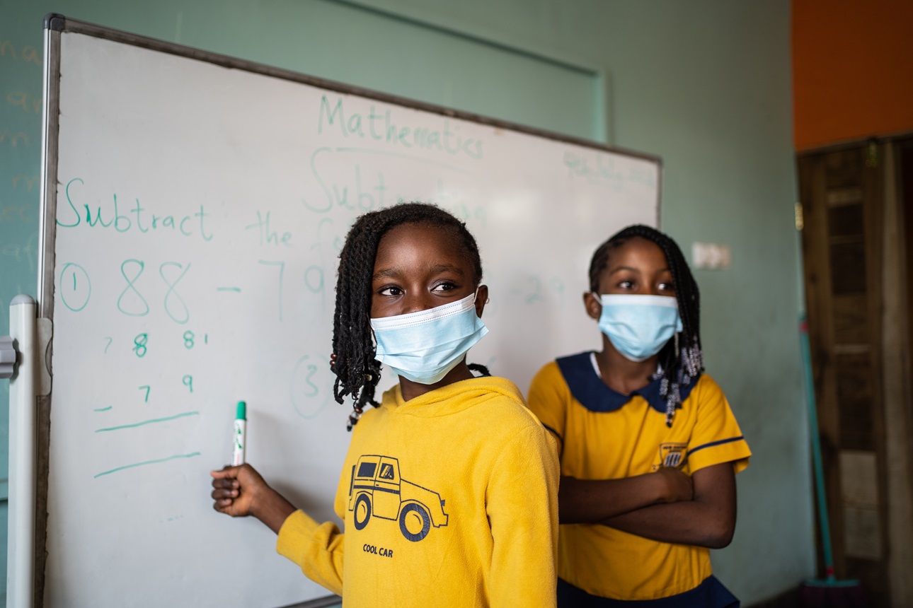 Students wear face masks during class at the New Edition school in Kasoa, Ghana, on July 4, 2022. 