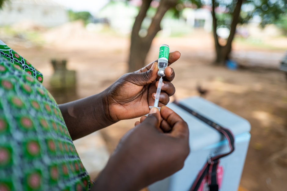 A nurse prepares a vaccine at the Kokrobite Health Center in Kokrobite, Ghana, on June 24, 2022. 
