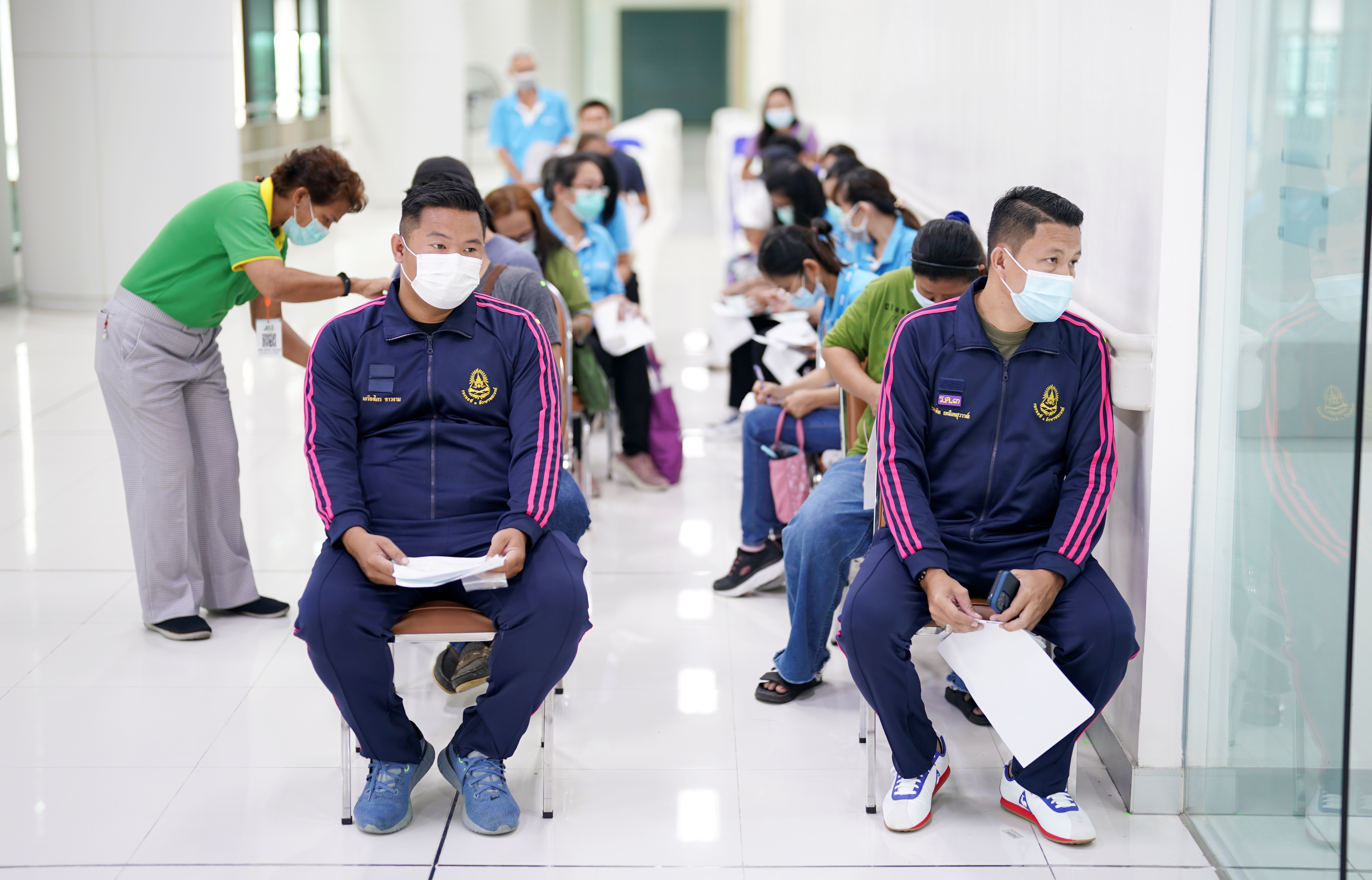 People wait to receive the second dose of Sinovac's COVID-19 vaccine at the Bang Khun Thian Geriatric Hospital in Bangkok, Thailand April 21, 2021. 
