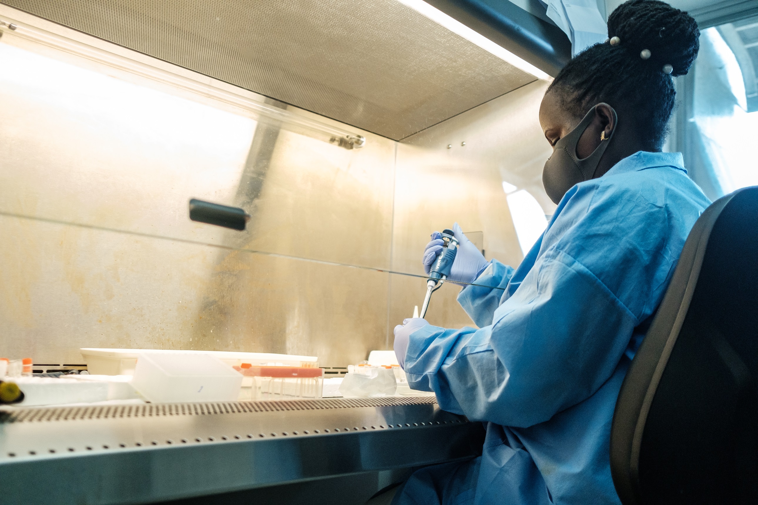 Lab worker Deborah Harriet sorts COVID-19 samples at the UVRI in Entebbe, Uganda, on January 21, 2022. 