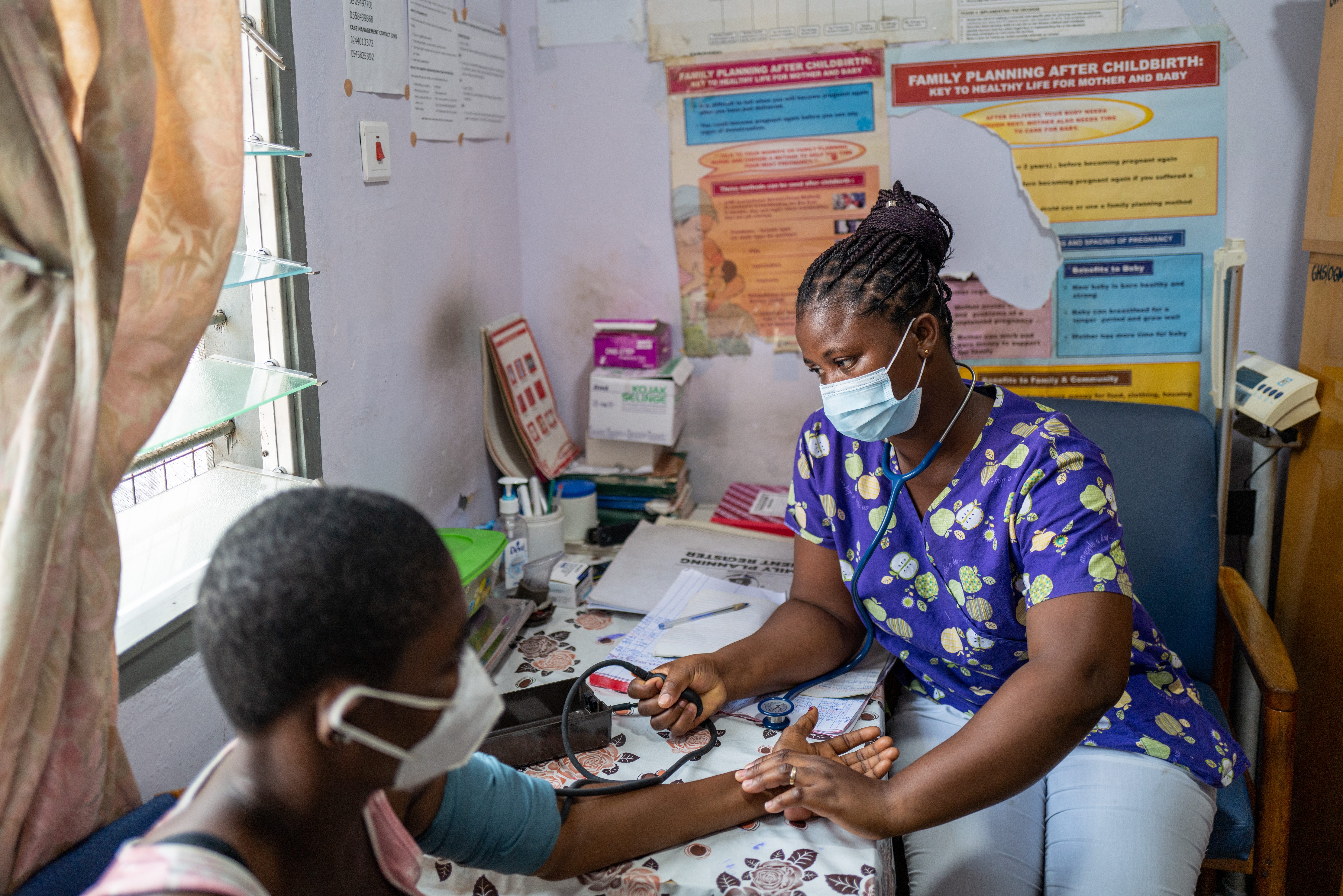 Nurse Elizabeth Asamoah takes a blood pressure reading at the Osu Government Maternity Home in Accra, Ghana.