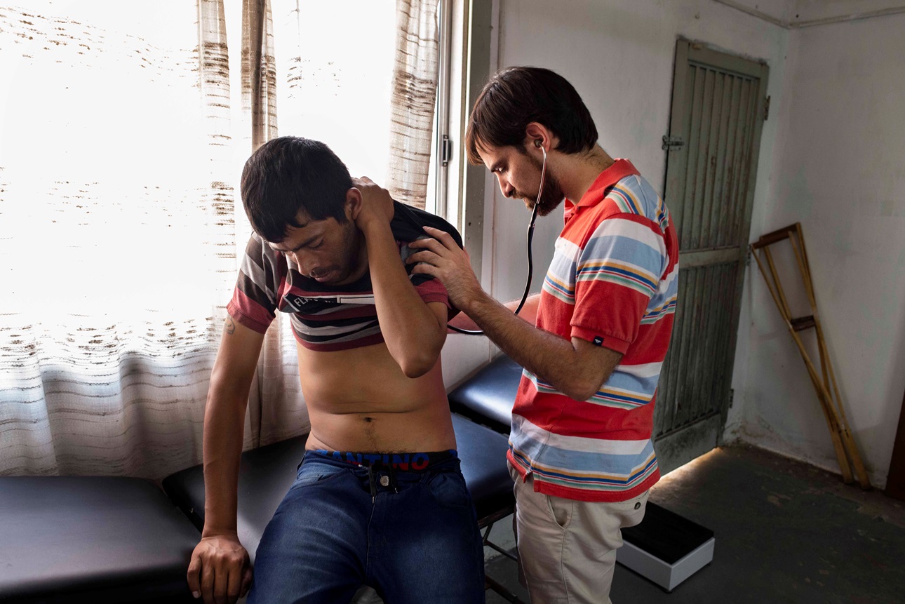 A doctor treats a TB patient in Argentina.