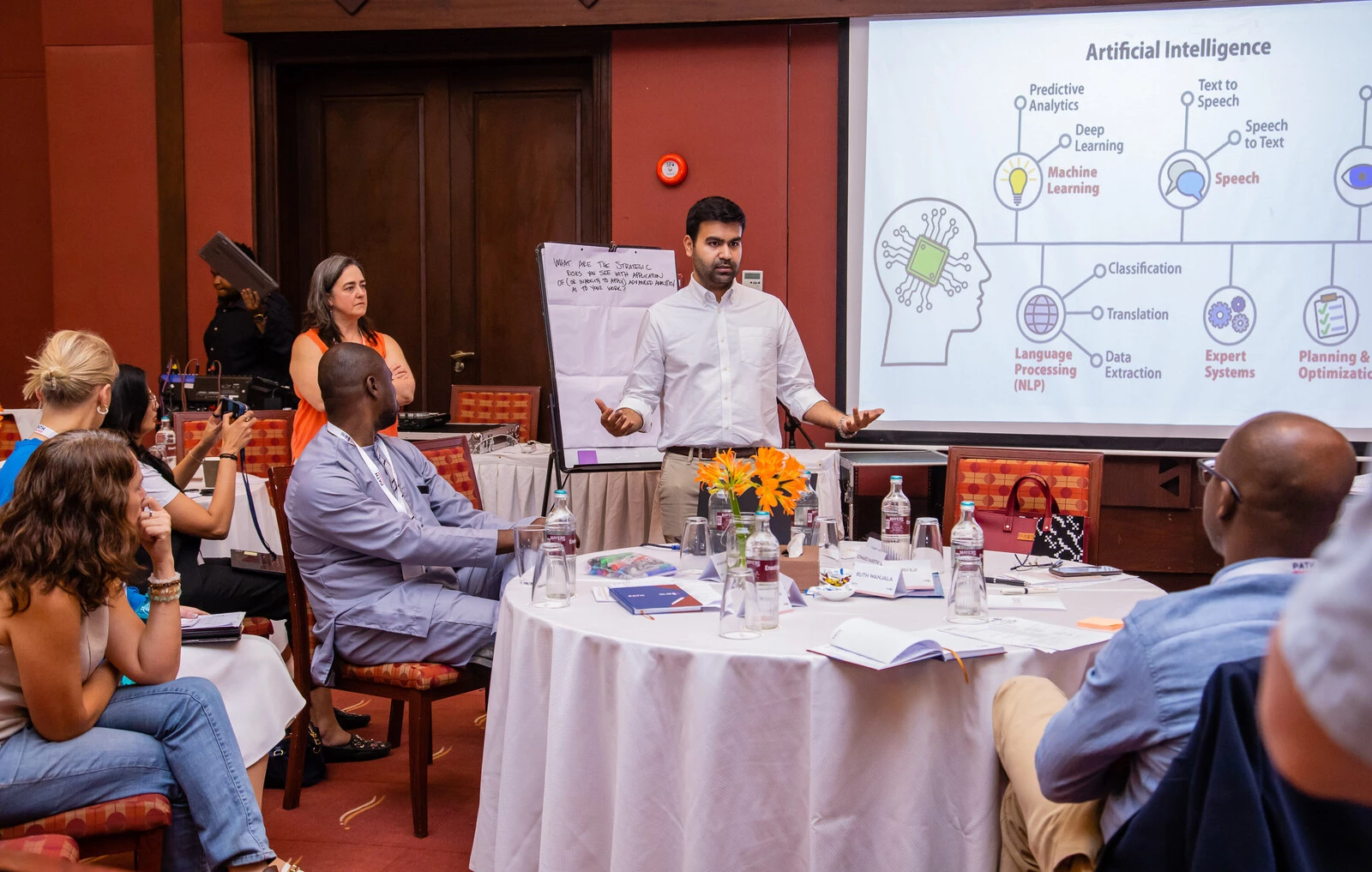 Dr Bilal Mateen, center, PATH's chief AI officer.