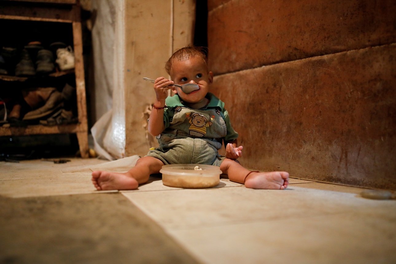 Houses with dirt floors and no running water, like this one in Venezuela, hinder public health progress.