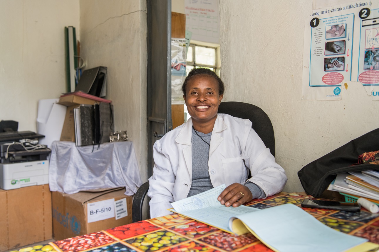 A health extension worker takes care of reports and administrative work at a health post.
