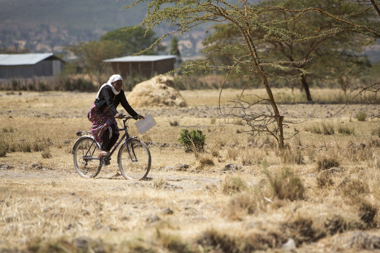 A health extension worker makes home visits by bicycle, traveling to reach families in rural areas.