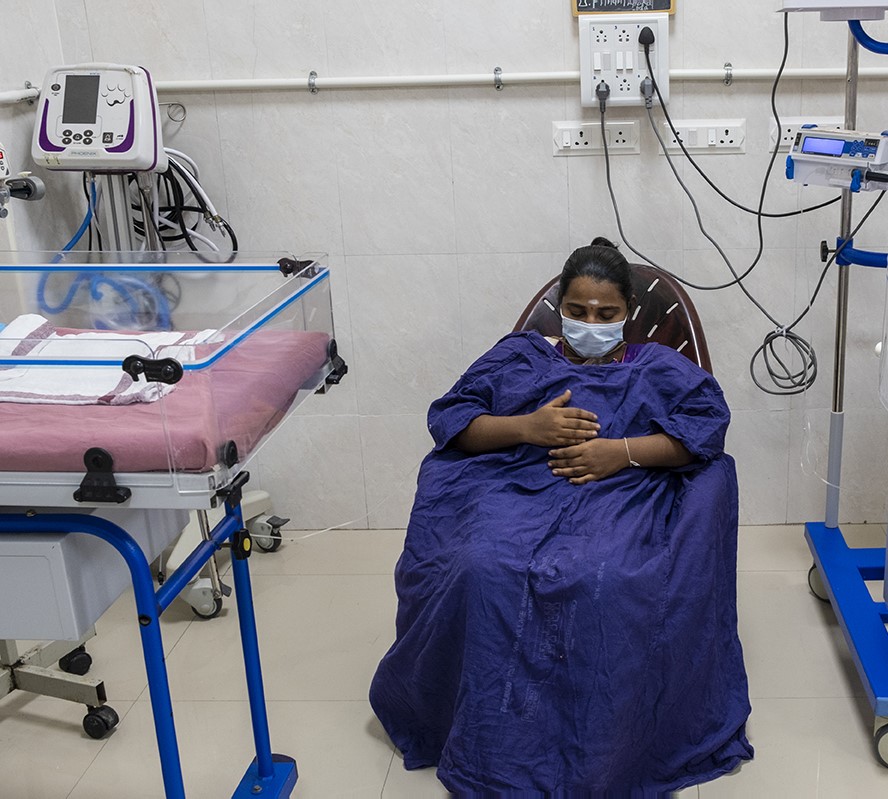 A mother provides kangaroo care in a Special Newborn Care Unit at a hospital in Tamil Nadu.