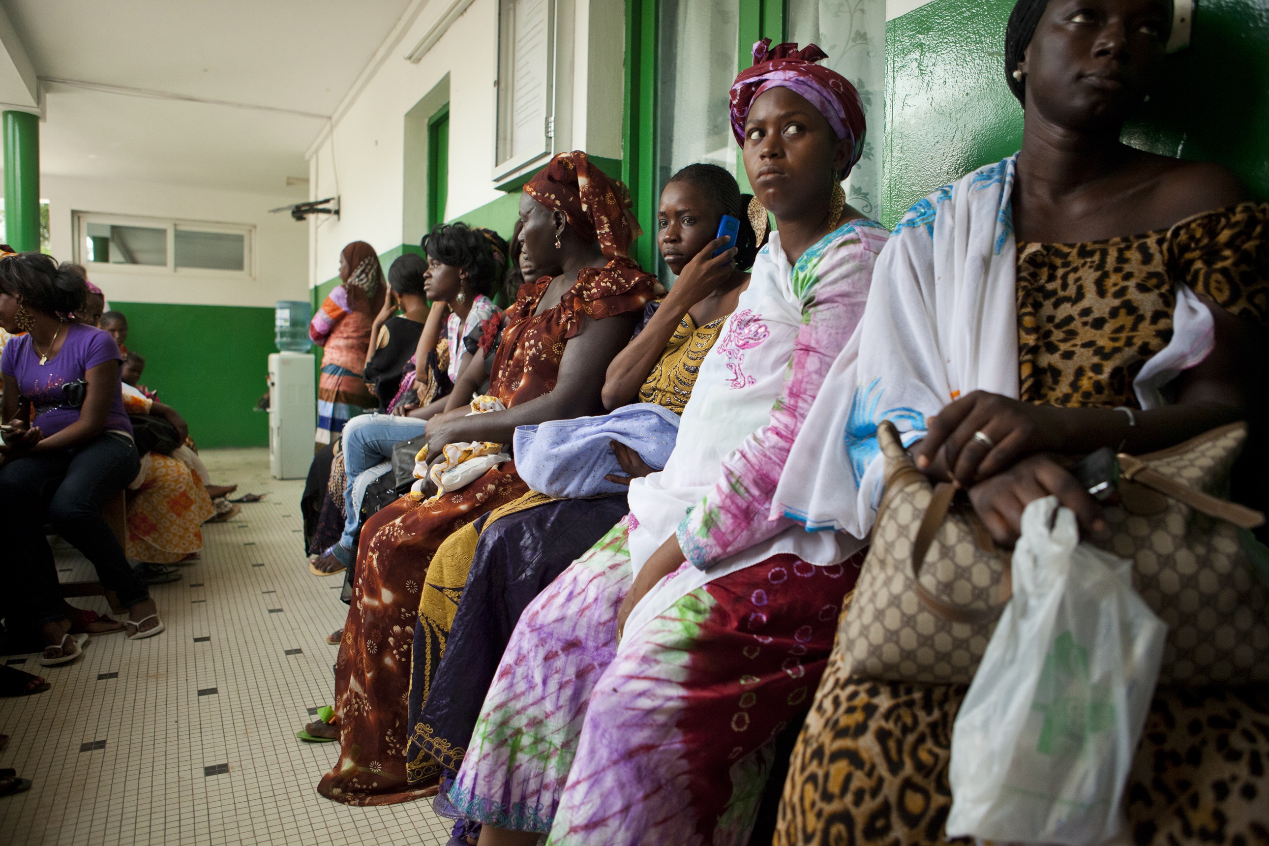 Women wait for postnatal consultations at a health center in Senegal.