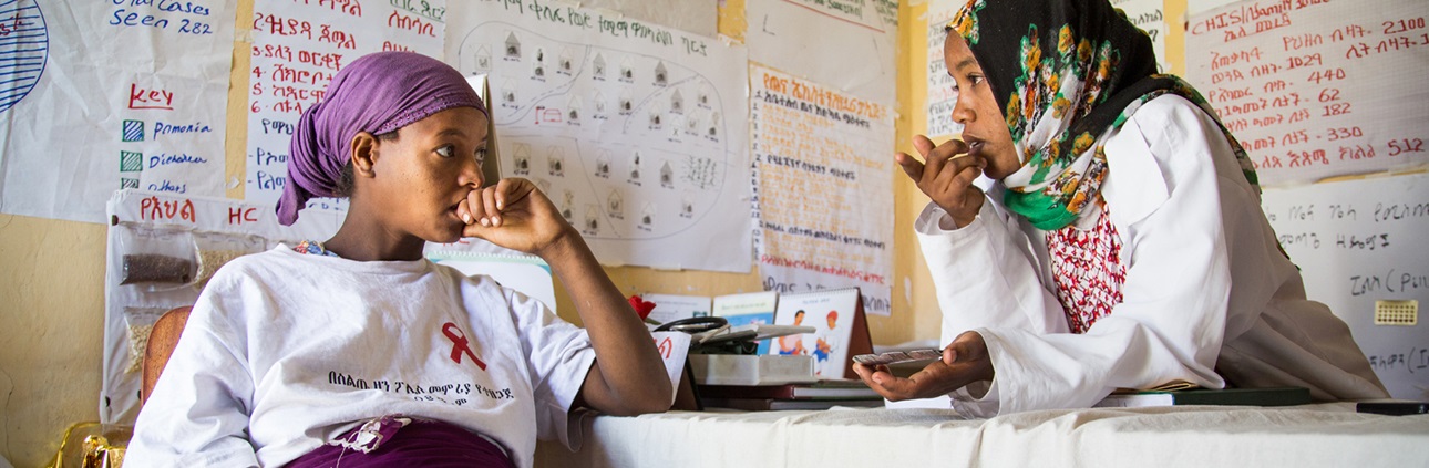 A health extension worker provides guidance on prenatal care to an expectant mother in Ethiopia.