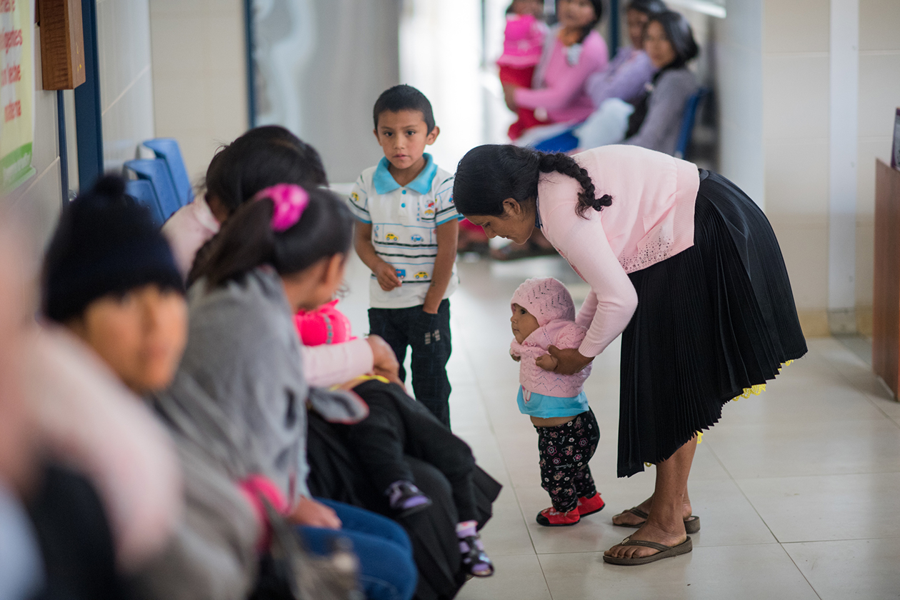 Families wait to see health workers at a clinic in Acomayo, Huánuco, in Peru.