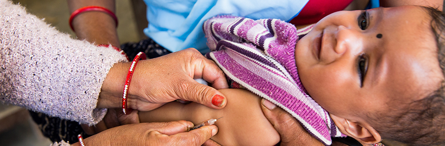 A five-month old infant  receives the DTP vaccination at a rural clinic in Nepal.