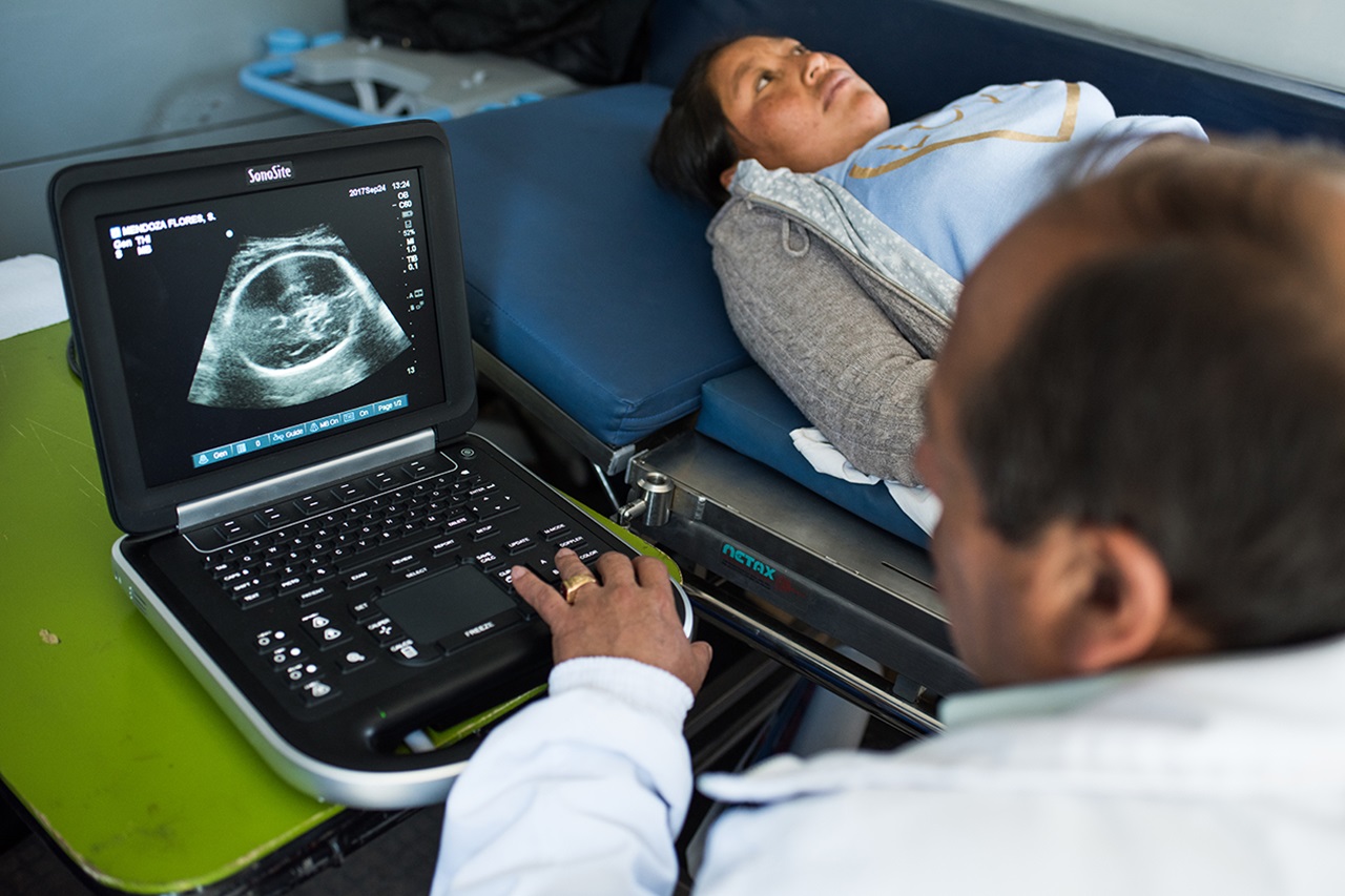 A pregnant woman receives an ultrasound exam in Peru.